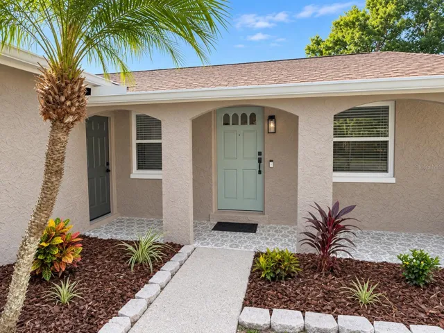 Front porch with mosaic tile flooring
