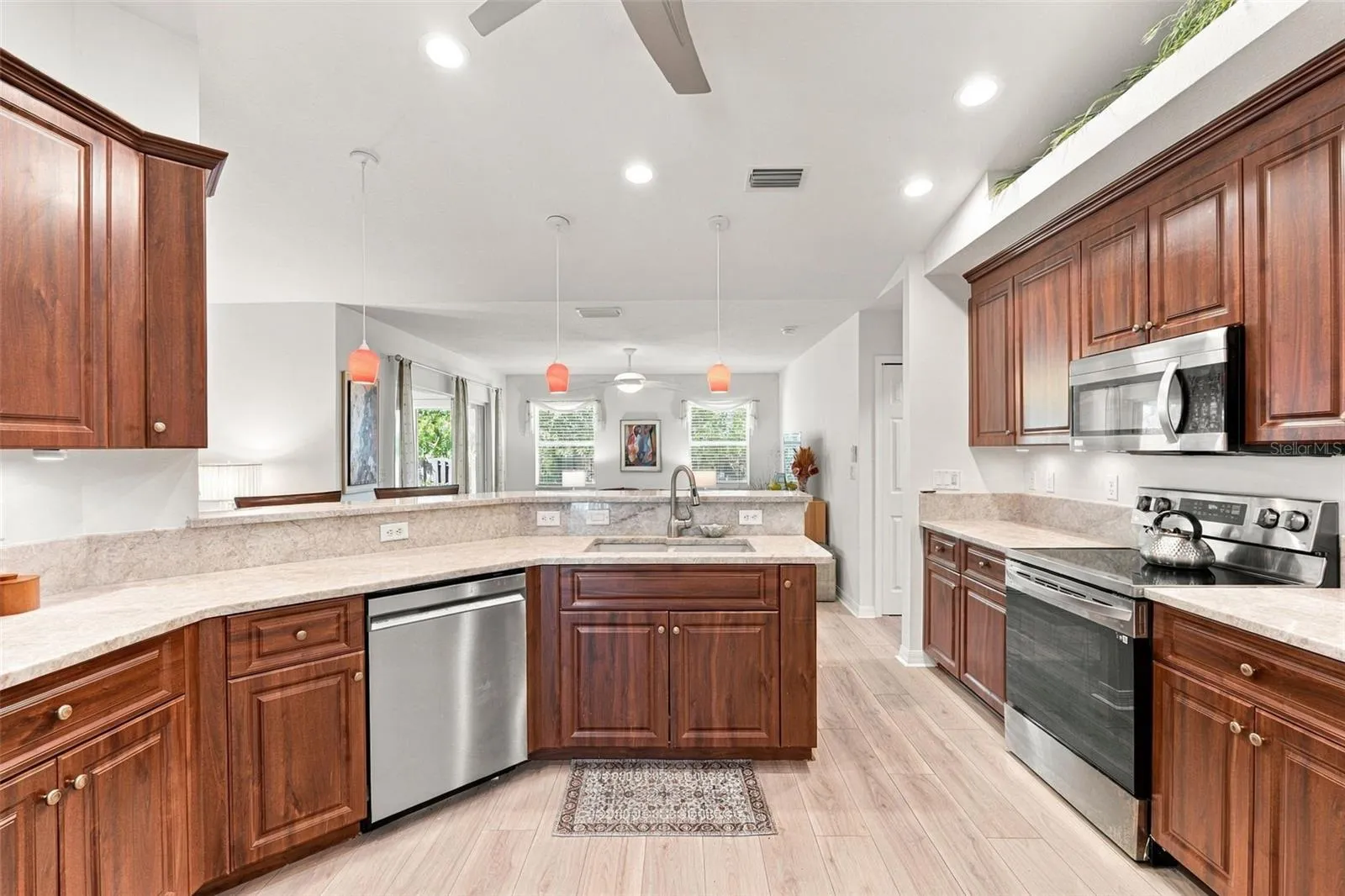 Quartzite Countertops Crowned With Cherry Cabinetry