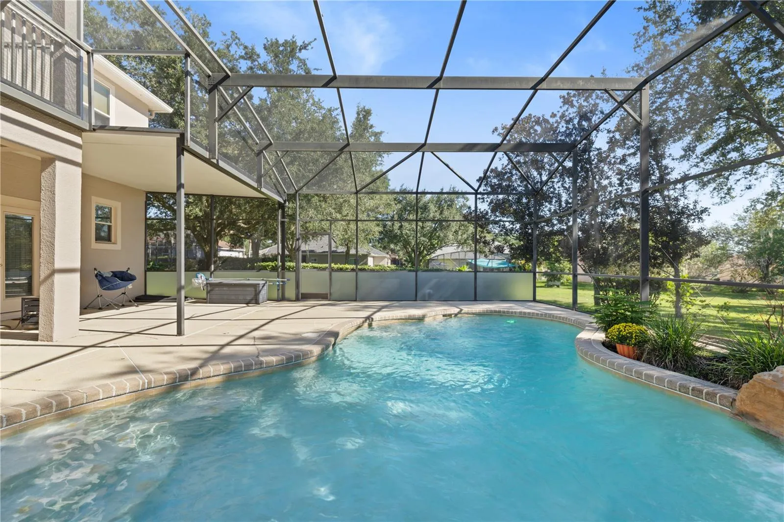 Custom-designed saltwater pool with a beautiful rock waterfal