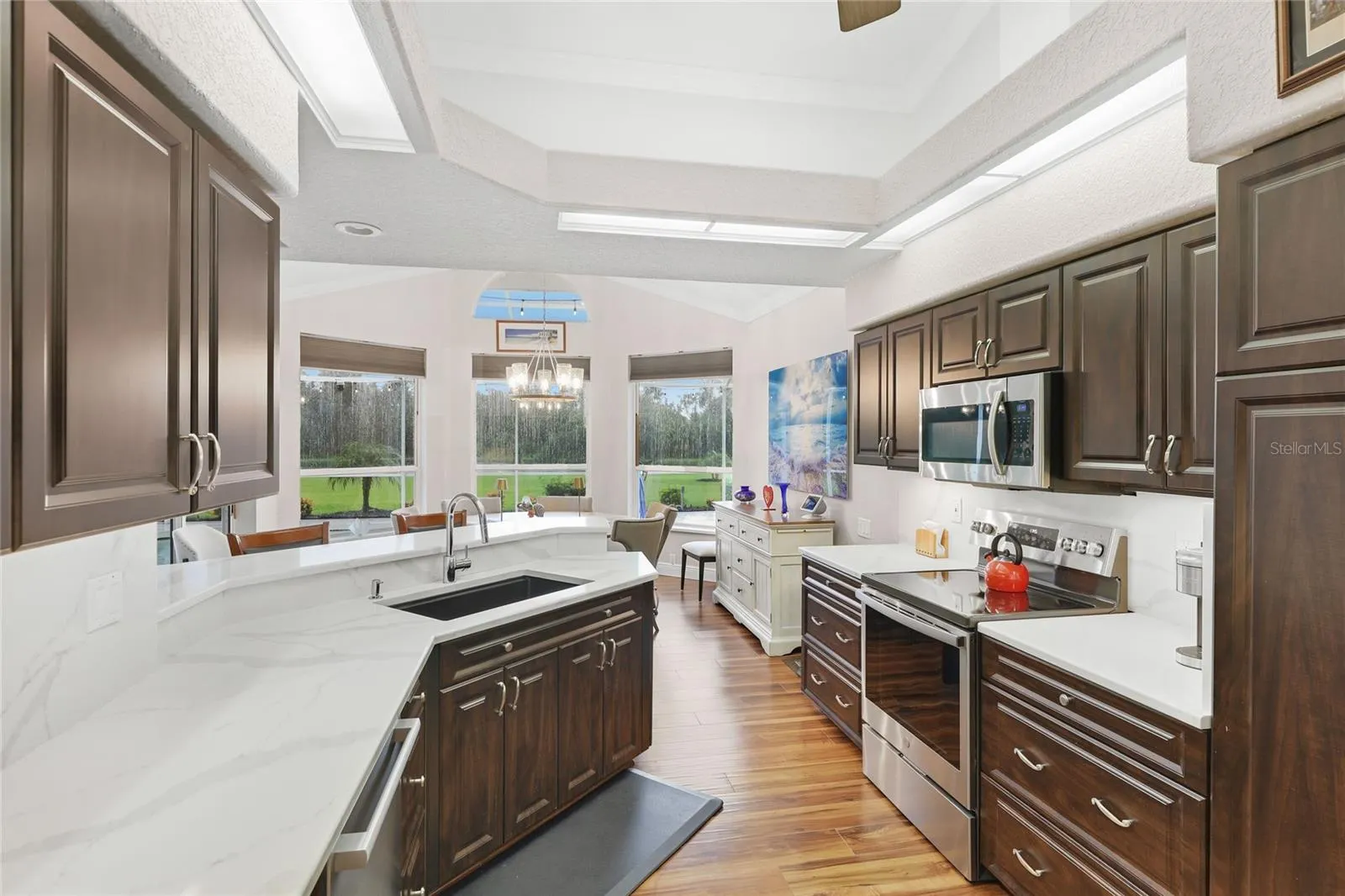 Updated kitchen appliances include a Bosch Benchmark dishwasher, GE profile range, and Bosch refrigerator.