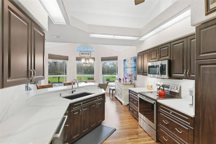 Updated kitchen appliances include a Bosch Benchmark dishwasher, GE profile range, and Bosch refrigerator.