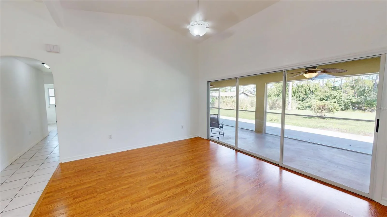 Living room overlooks the huge lanai and private backyard.