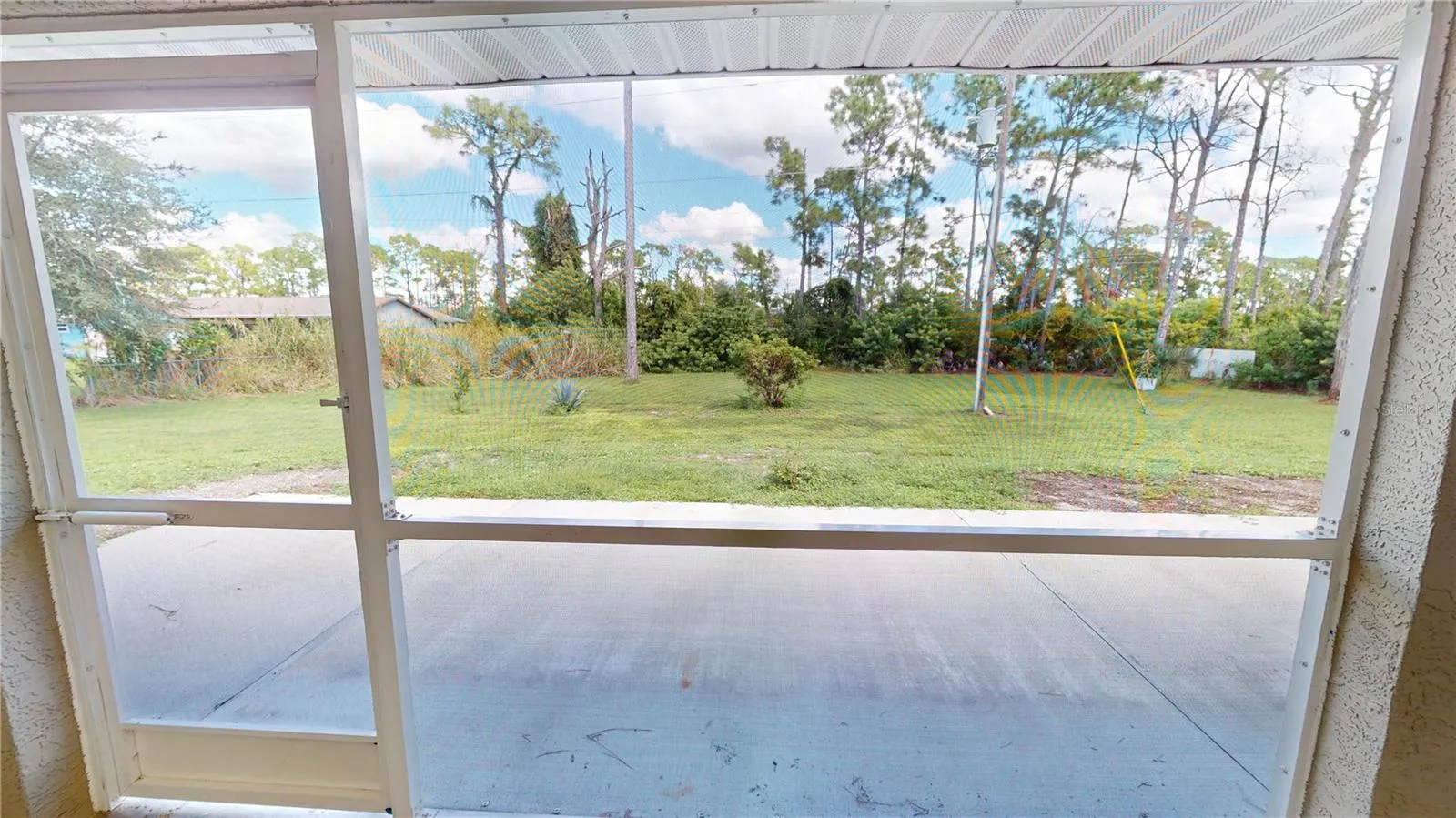 Just outside the lanai is an additional concrete patio for grilling out or soaking up the sunshine.