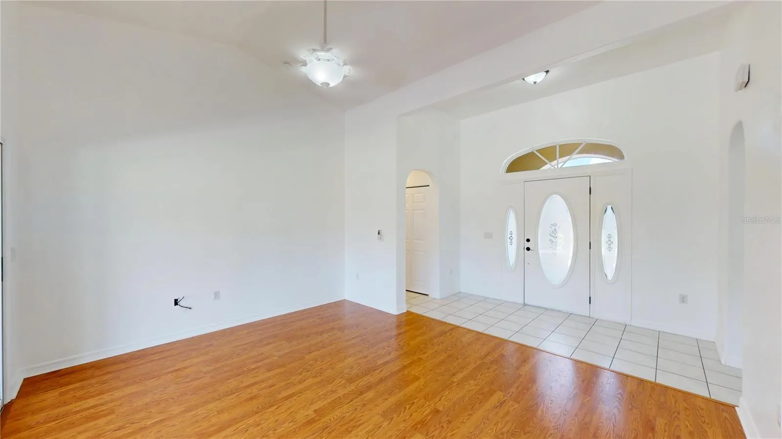Front entry provides natural light and still privacy.