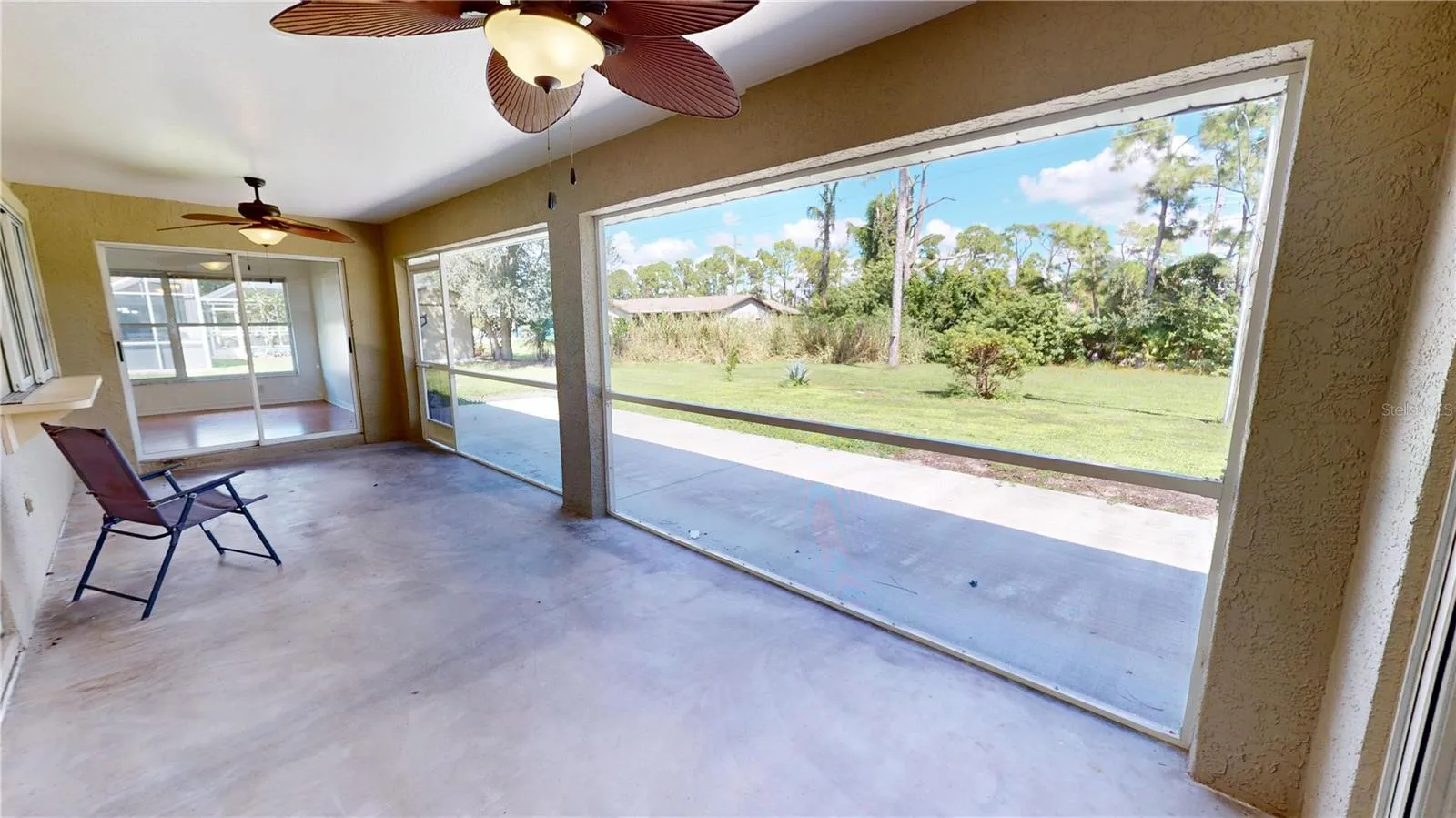 Covered and enclosed lanai is the perfect place to enjoy the serenity and privacy of your backyard.