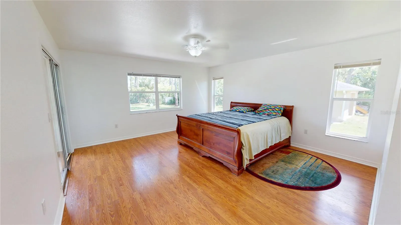 Huge main bedroom includes a sliding glass door to the lanai.