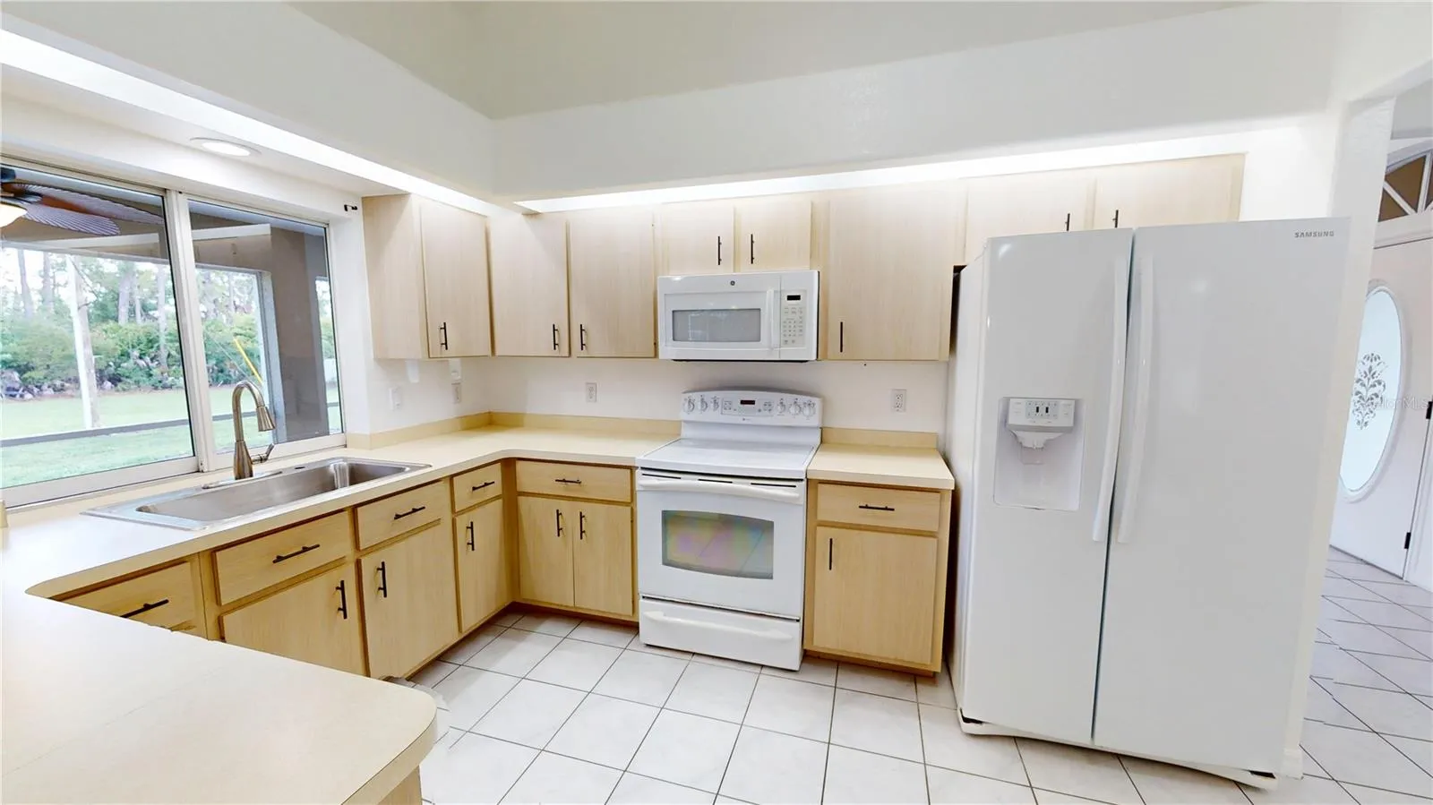Spacious kitchen with a window over the sink.