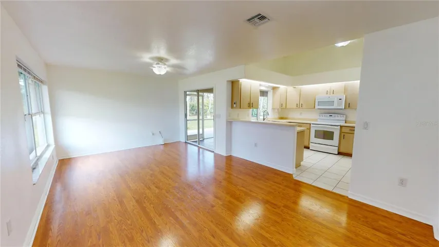 Kitchen opens to the dining room/family room combo.