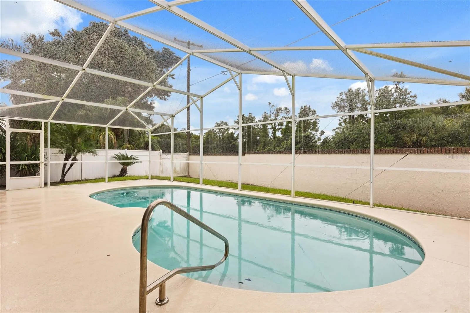 Recently resurfaced pool and re screened lanai.