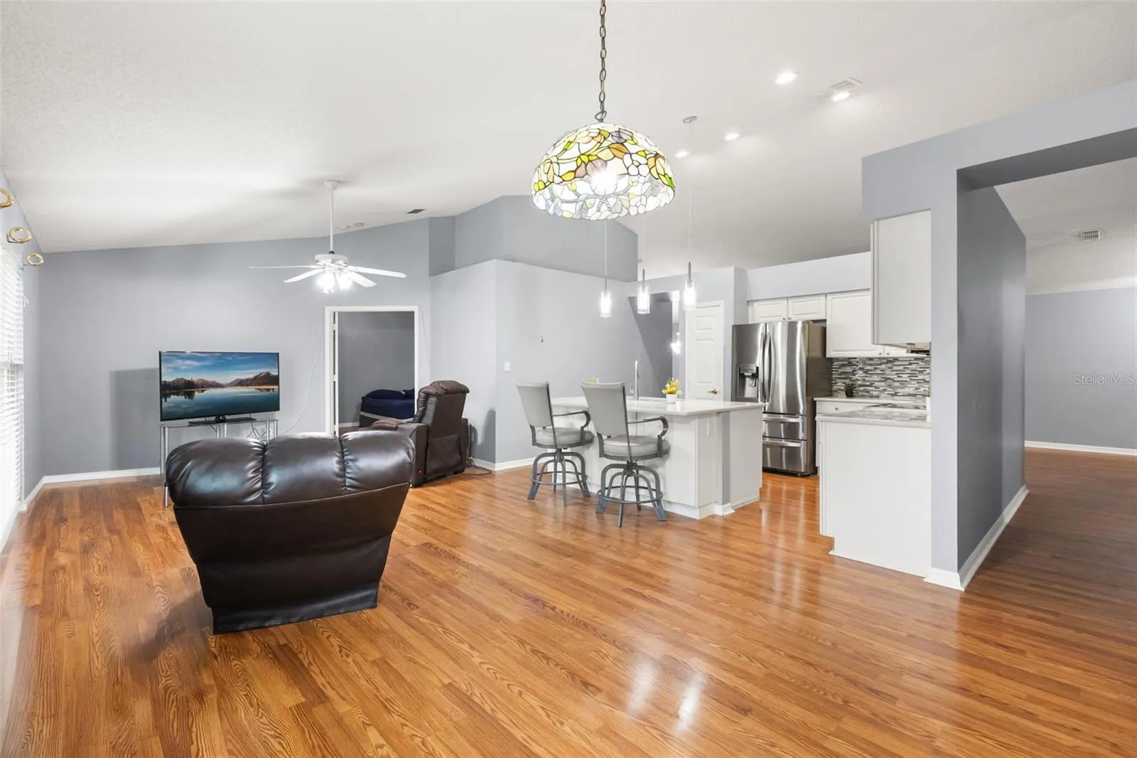 Same view of family and dinette with current owner's furniture