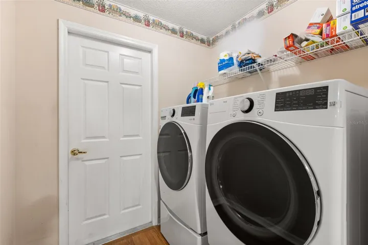 Inside laundry room. LG washer n dryer convey