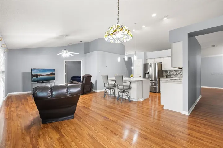 Same view of family and dinette with current owner's furniture