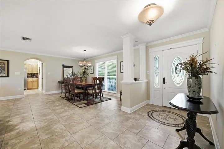 Welcoming foyer opens up to formal dining and family room