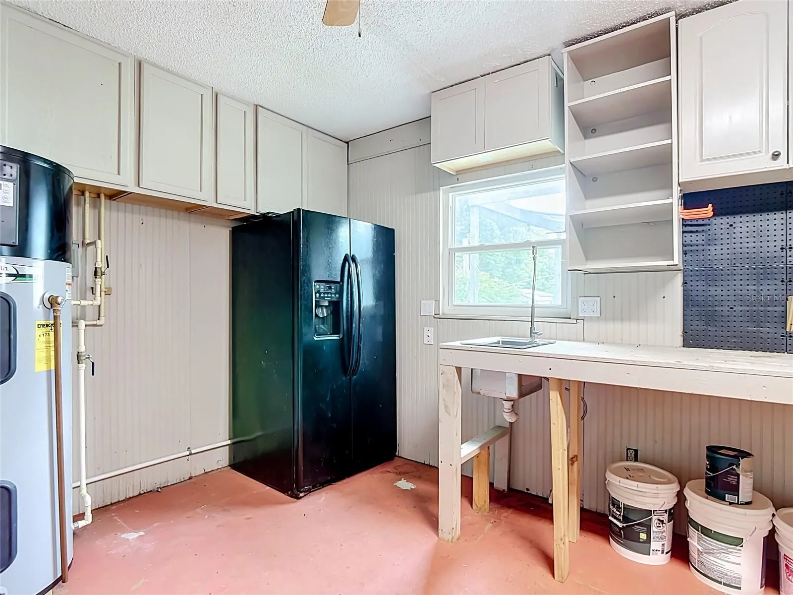Refrigerator in garage conveys.
