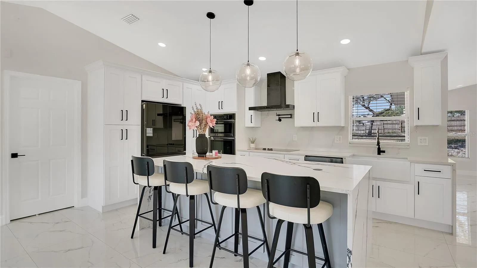 Kitchen with center island and bar seating