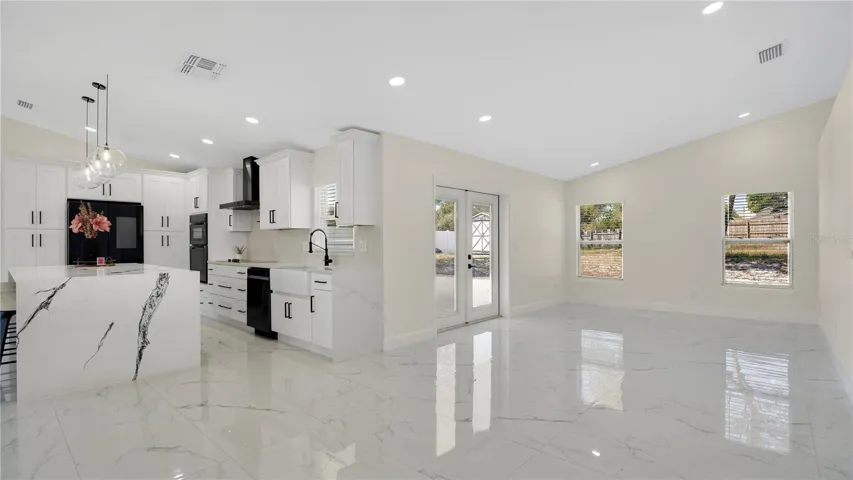 Open living area with vaulted ceilings