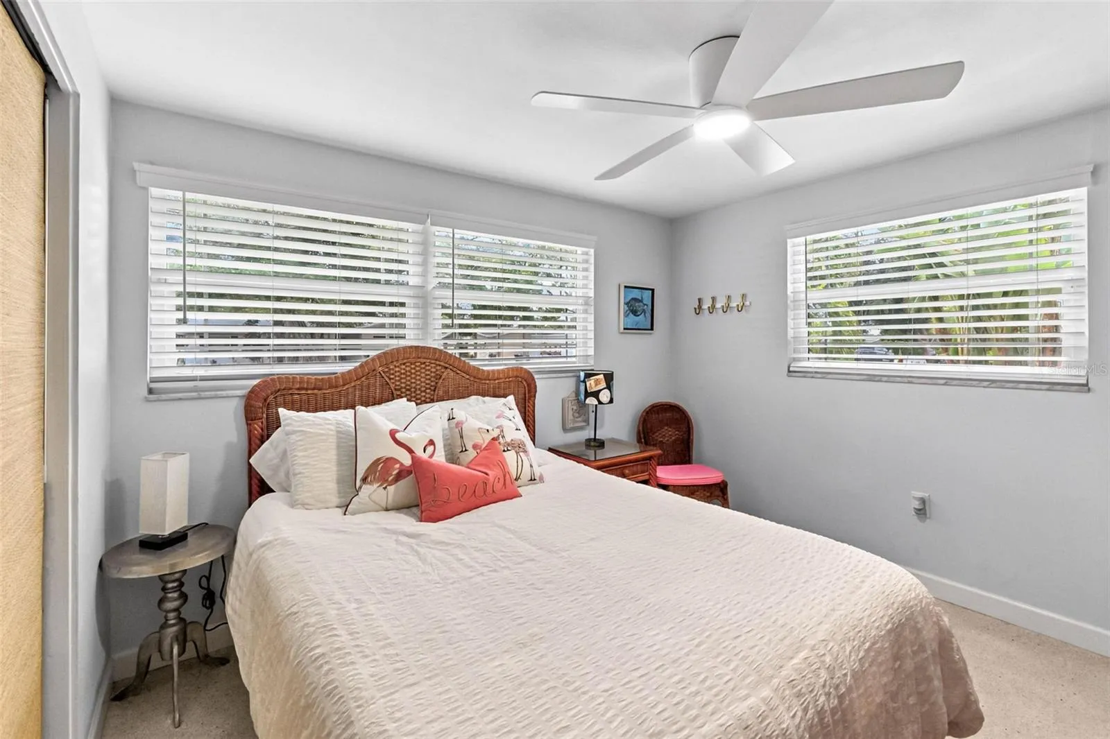Guest bedroom with windows on two sides.
