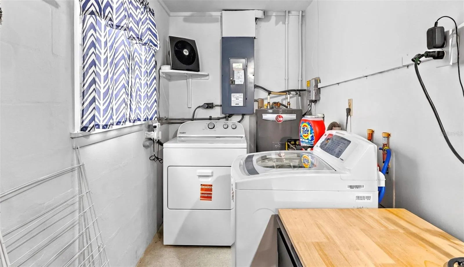 Laundry area with washer, dryer and utility sink.