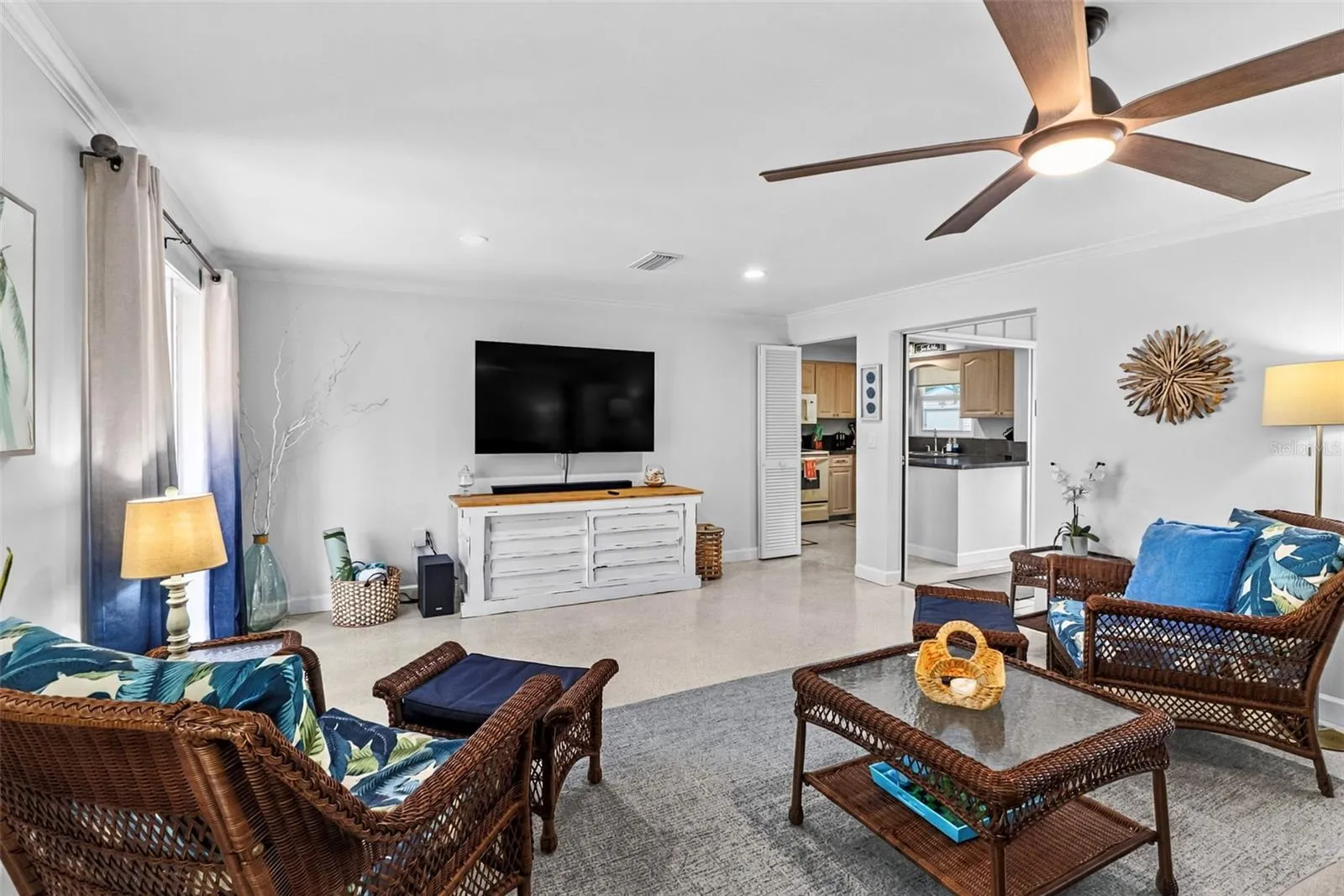 Living room seating area with tropical accents.