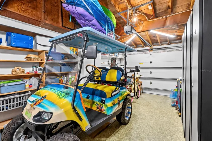 Alternate garage view. Golf cart excluded; available for separate purchase.