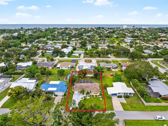 Aerial view of the home and surrounding neighborhood with close proximity to Gulf.