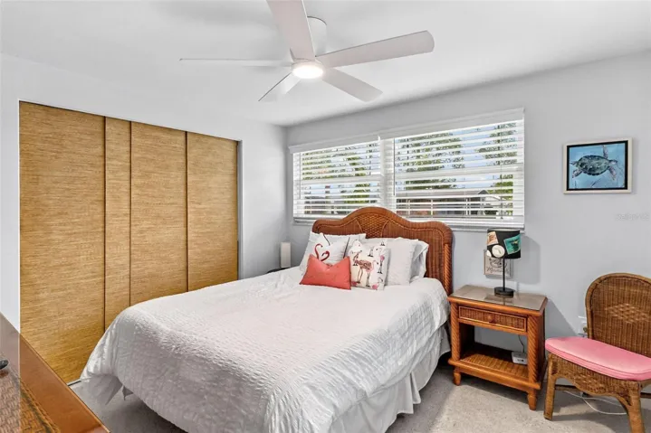 Guest bedroom with built-in closet storage.