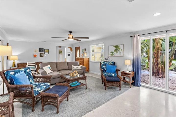 Living room seating area with tropical accents.