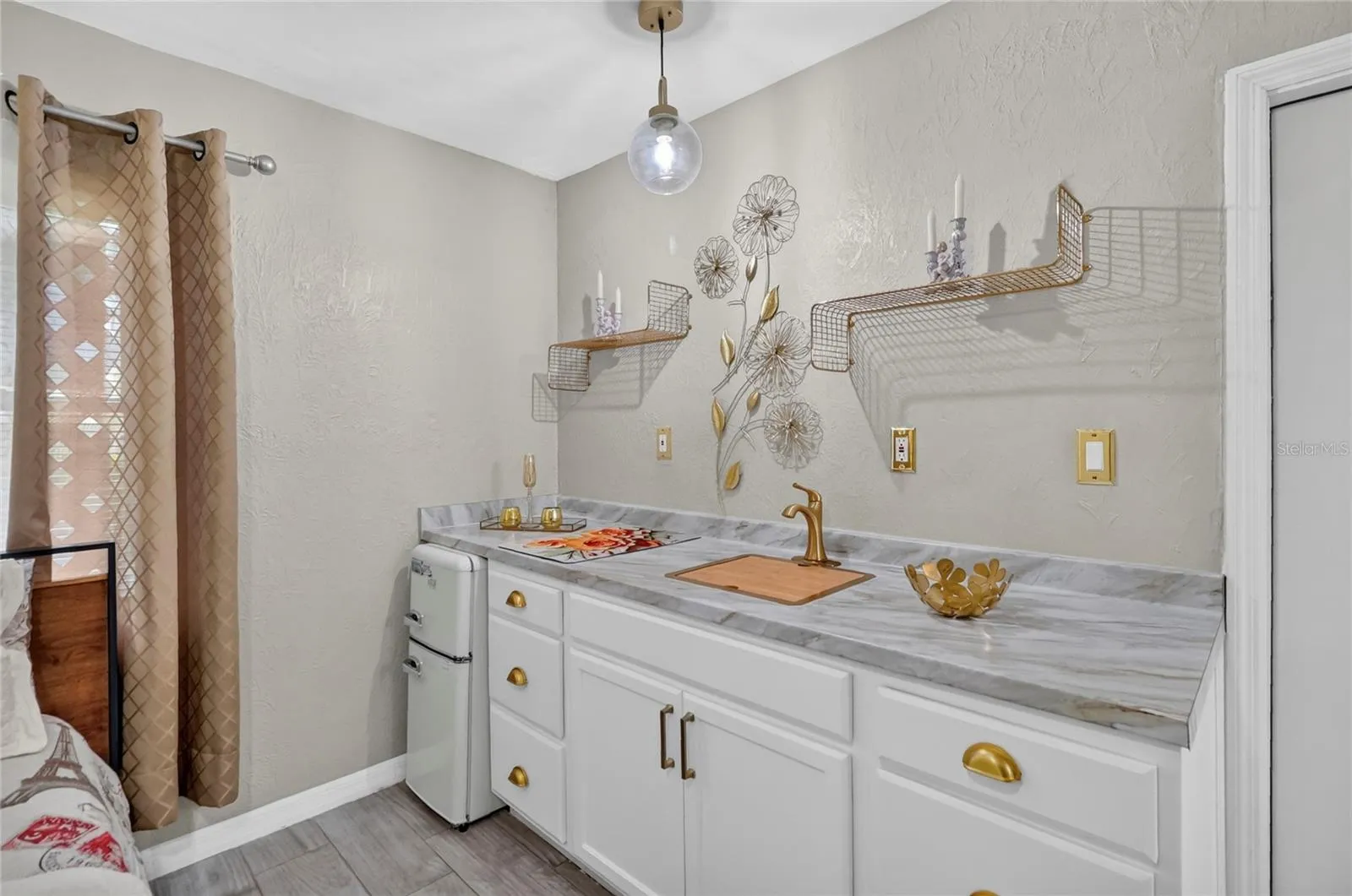 Kitchenette is easily removable. Comes with a sink, electric stovetop, small fridge and microwave