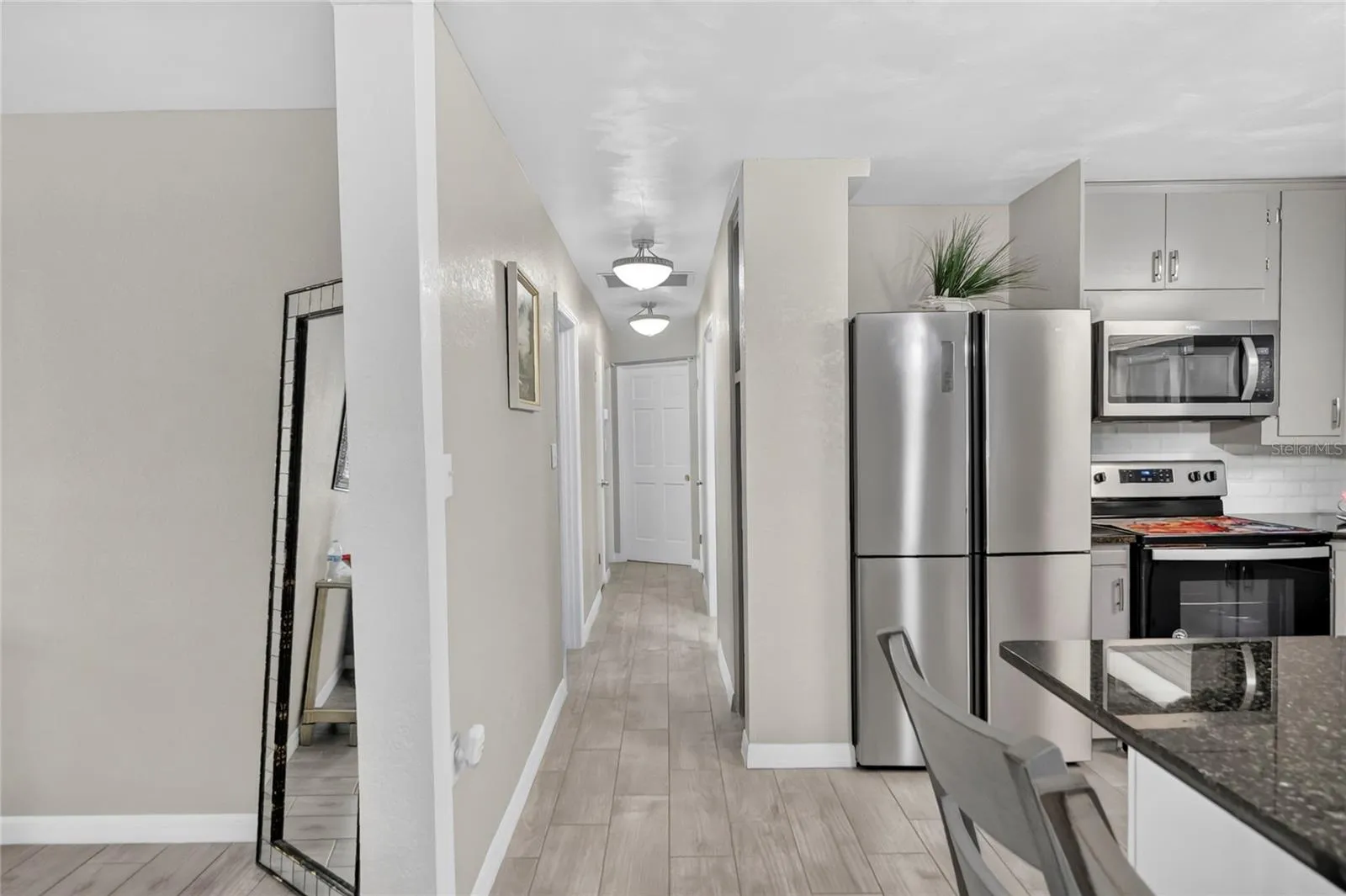 Hallway to the 3 bedrooms and 2 bathrooms