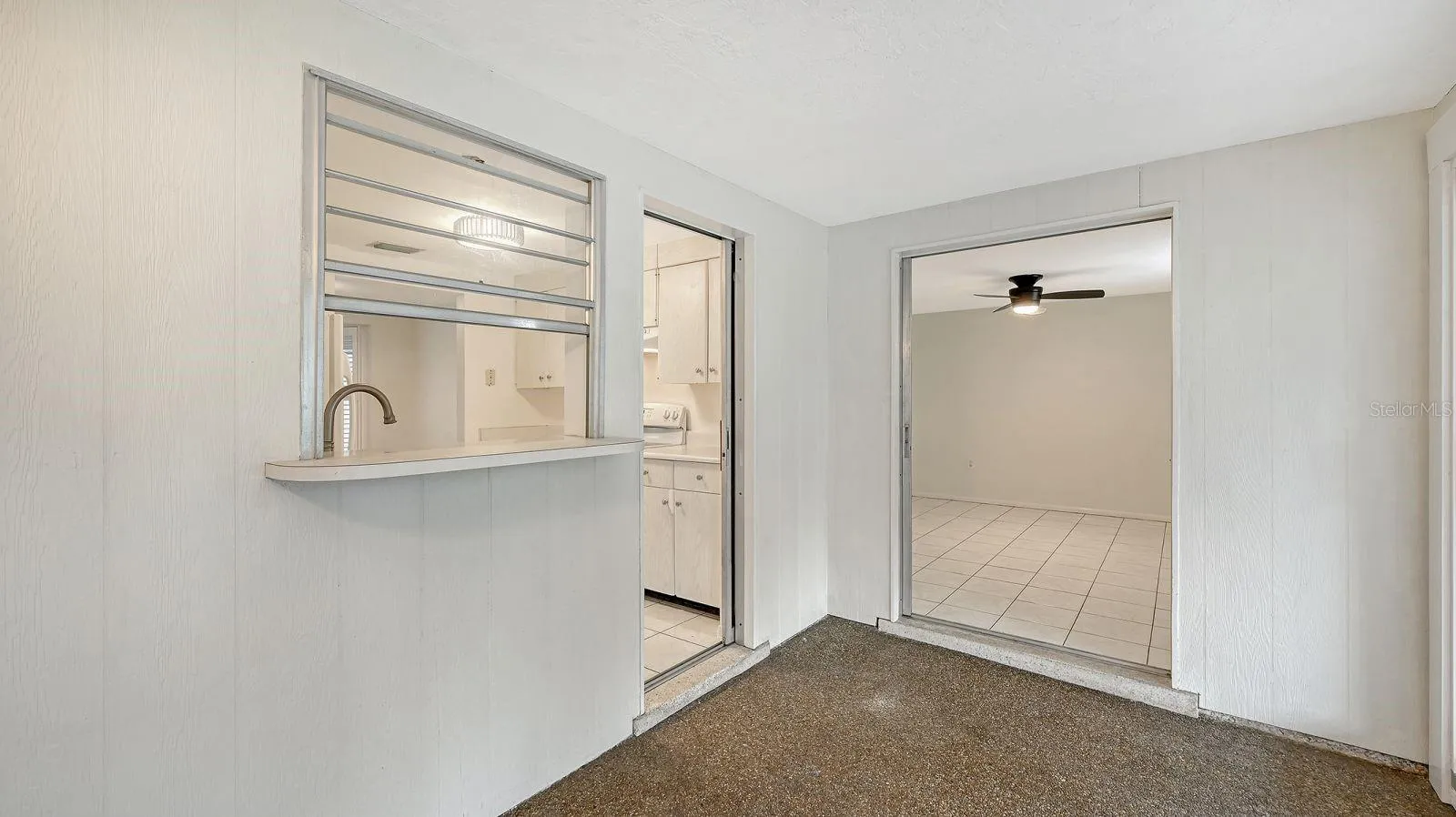 Pass thru window and door from the Kitchen to the Florida Room