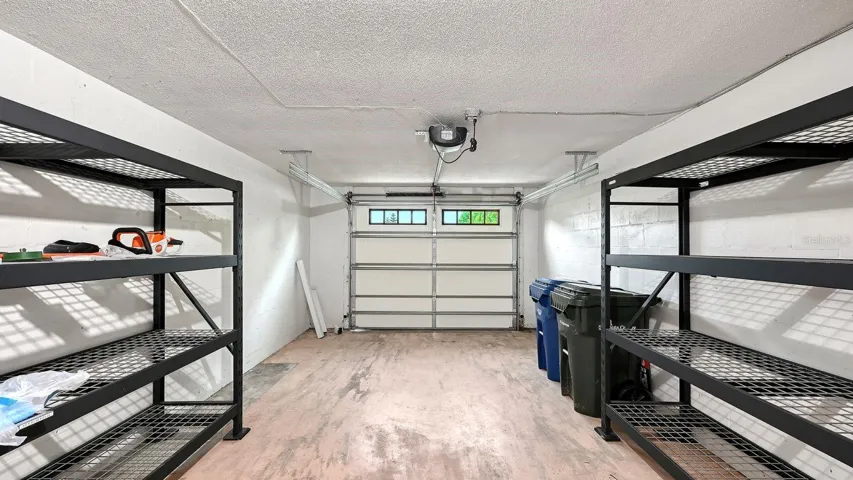 Spacious, One Car Garage with a Hurricane Garage Door &amp; Storage Racks