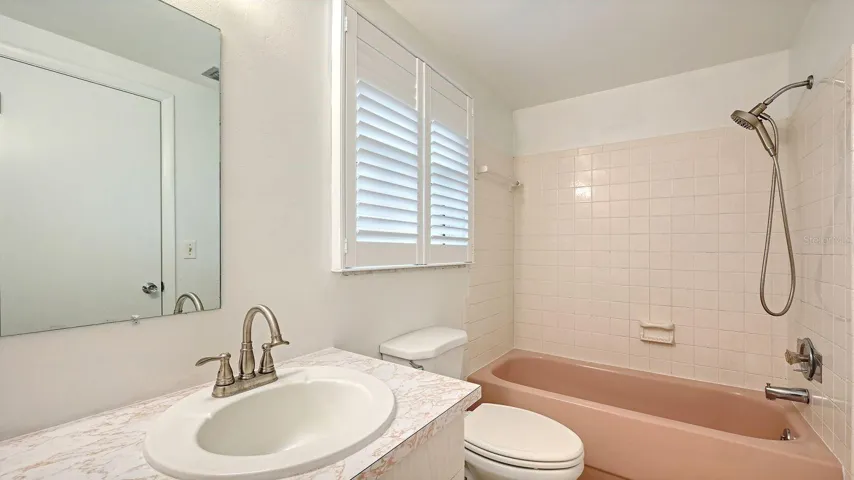 Primary Bathroom with a Tub/Shower Combo.