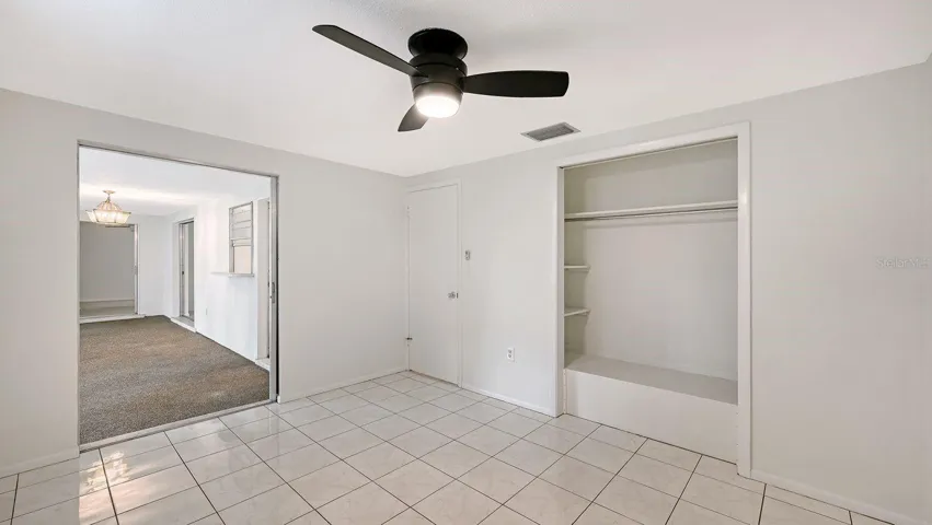 Guest Bedroom with a Slider to the Florida Room