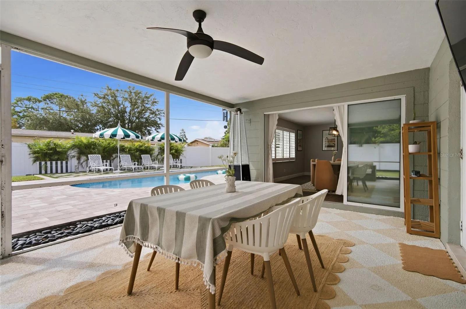 Covered And Screened Lanai With View Of Pool