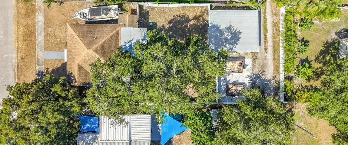 Large Lot with a rare detached 2 car garage and alley access with additional parking