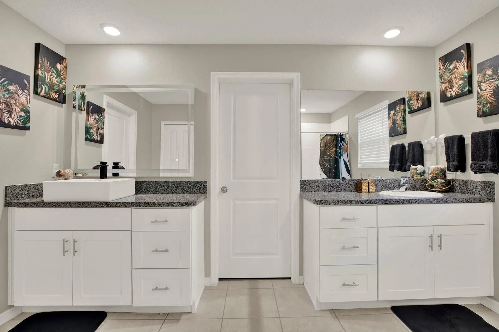 Double sink primary bedroom with shower