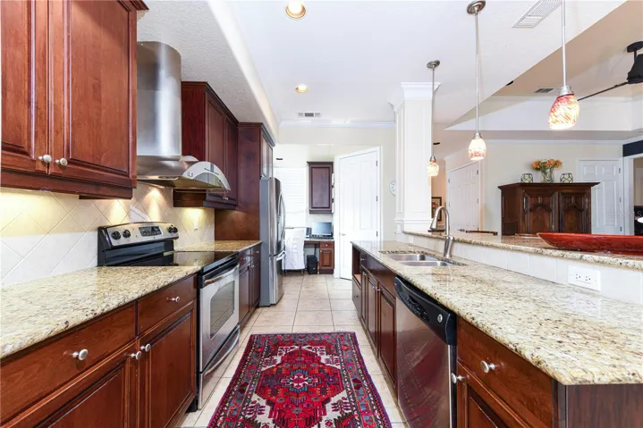 Galley Kitchen with stainless appliances