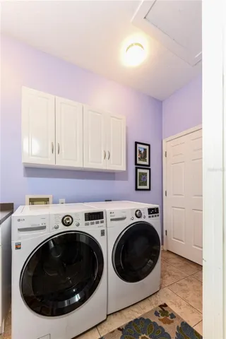 Interior laundry room on floor with living area.