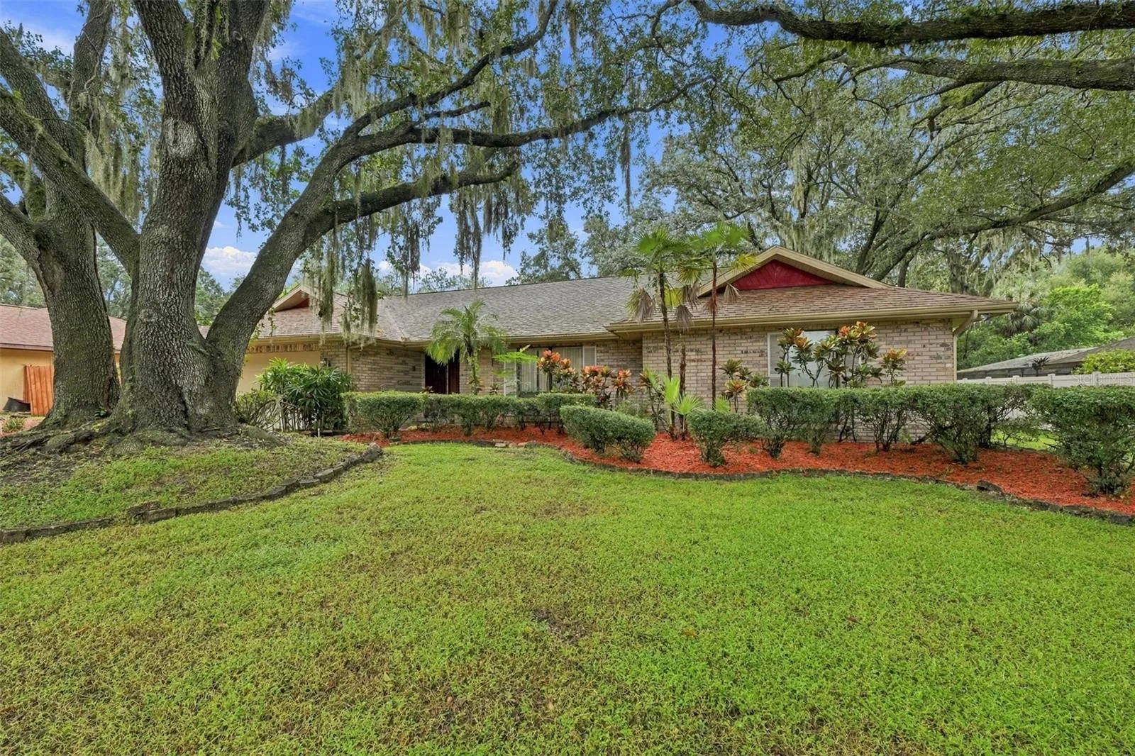 This house sits on over third of an acre. Landscaping is simple and easy to care for in this huge front yard.