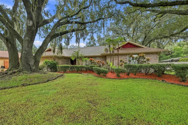 This house sits on over third of an acre. Landscaping is simple and easy to care for in this huge front yard.