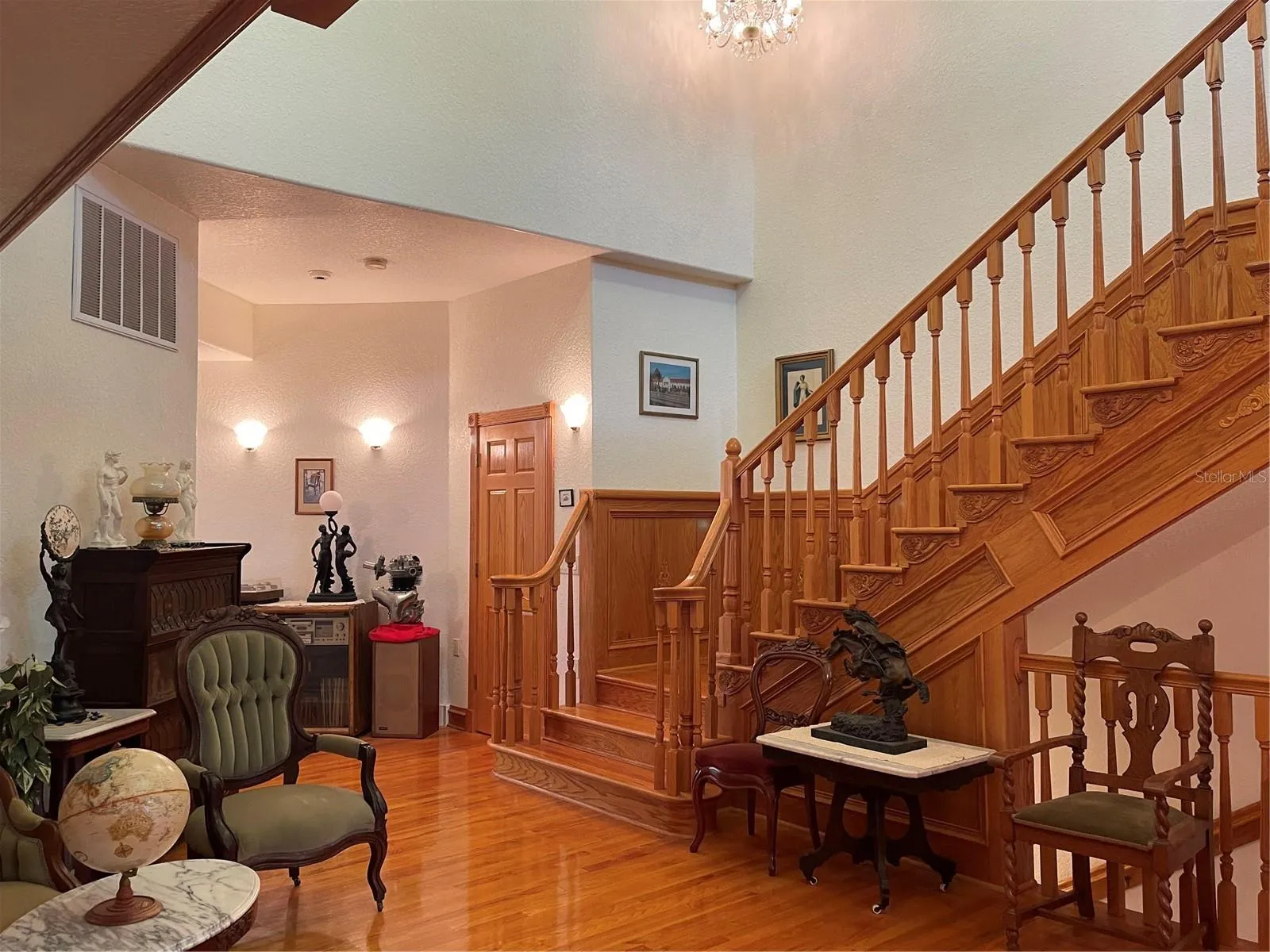 To the left of the storage closet is the living room, kitchen and primary bedroom
