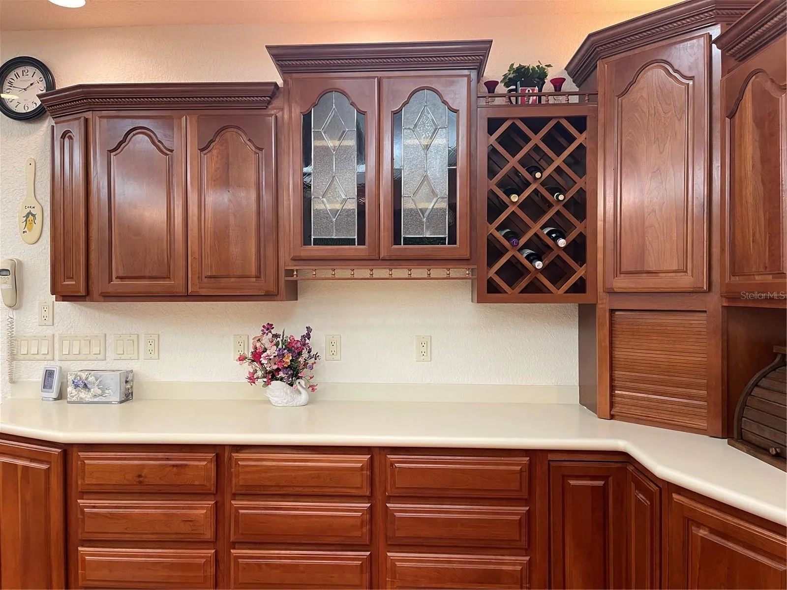 Sherok handcrafted Cherry wood cabinetry and stain glass accent panels.