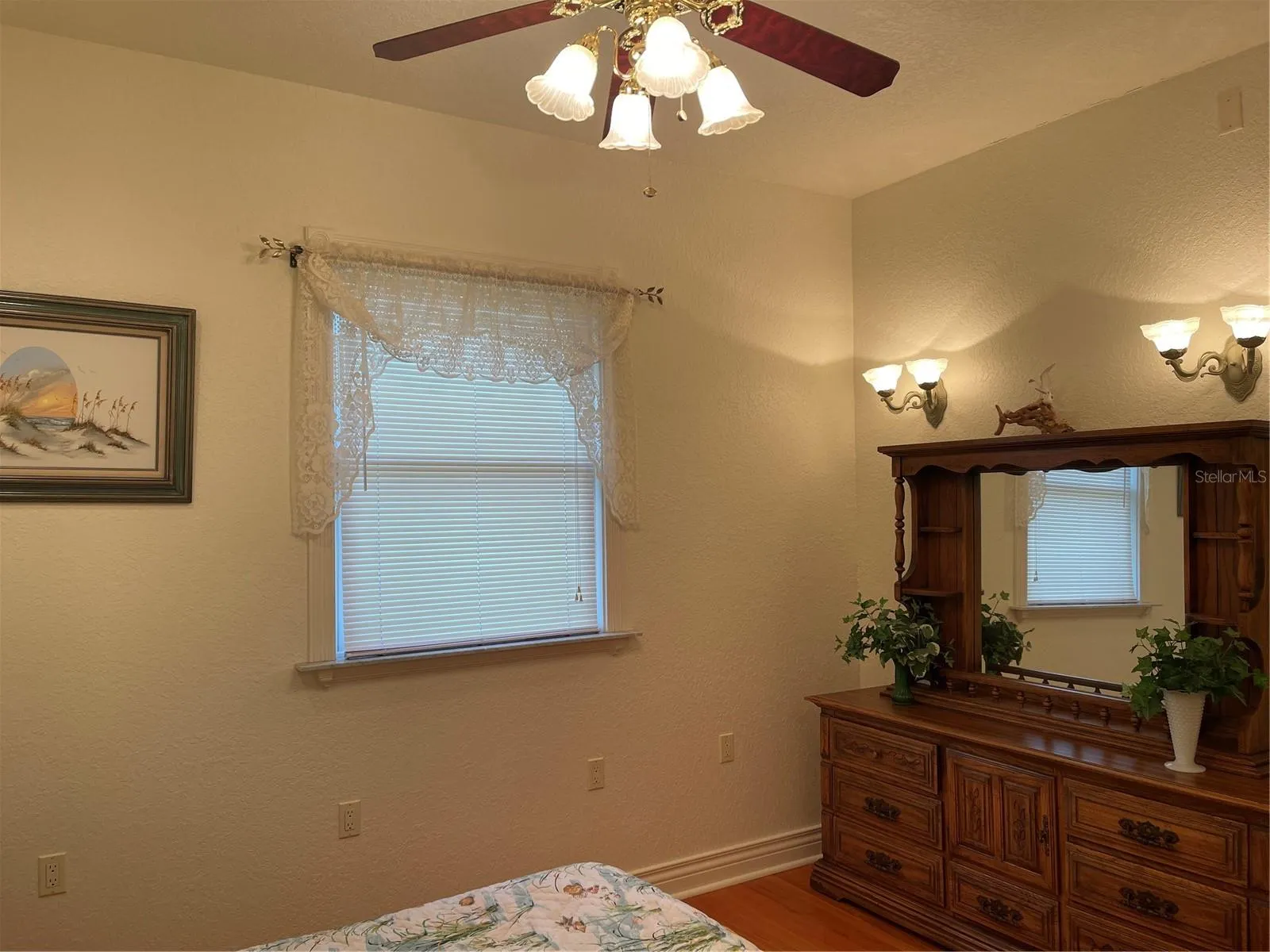 2nd bedroom has brass ceiling fan and recessed ligthing.