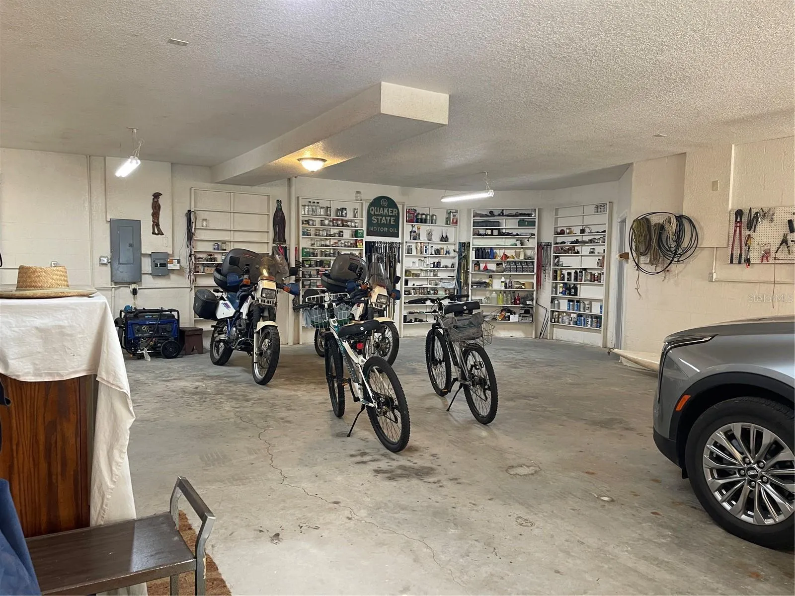 The garage and workshop square footage is approximately 2,075 sq ft. Which does not include the additional two utility rooms