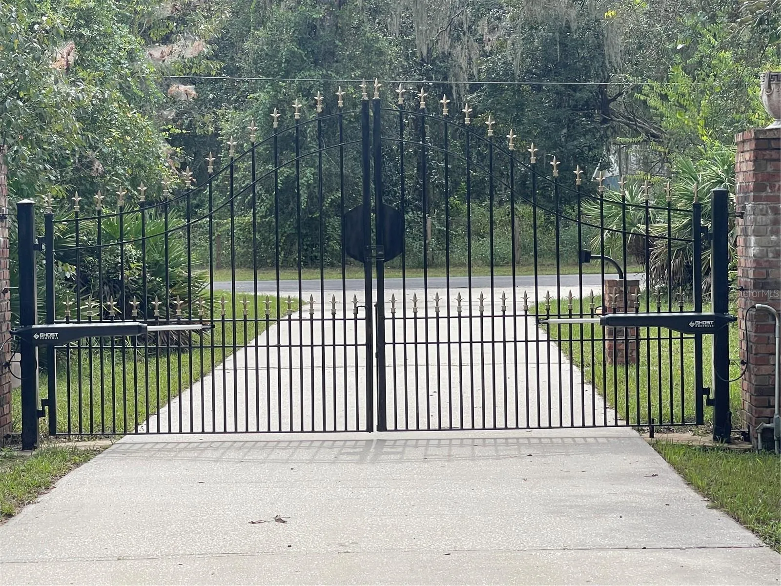 Electronic steel gate at front of 412 foot driveway.