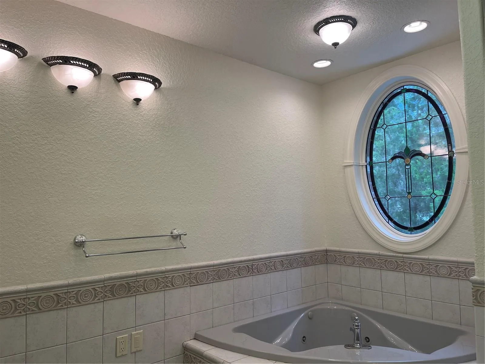 Jet tub - Anderson opal stain glass window