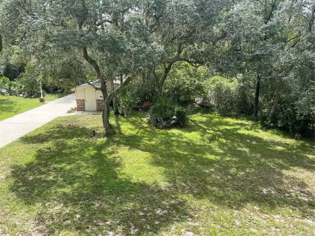 Yard, IN the distance is the well pump house and storage