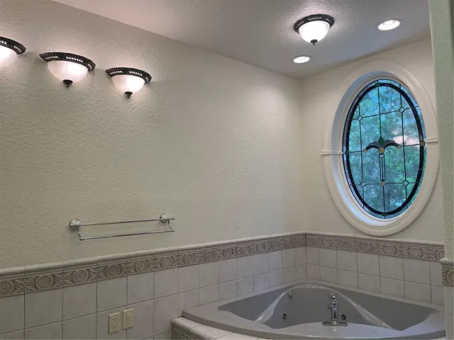 Jet tub - Anderson opal stain glass window