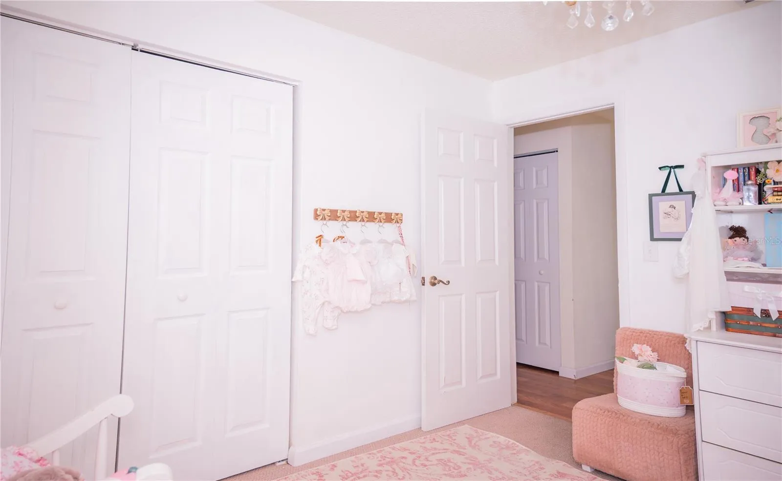 This room offers a peaceful view looking out into the hallway, highlighting the desirable split-bedroom floor plan.