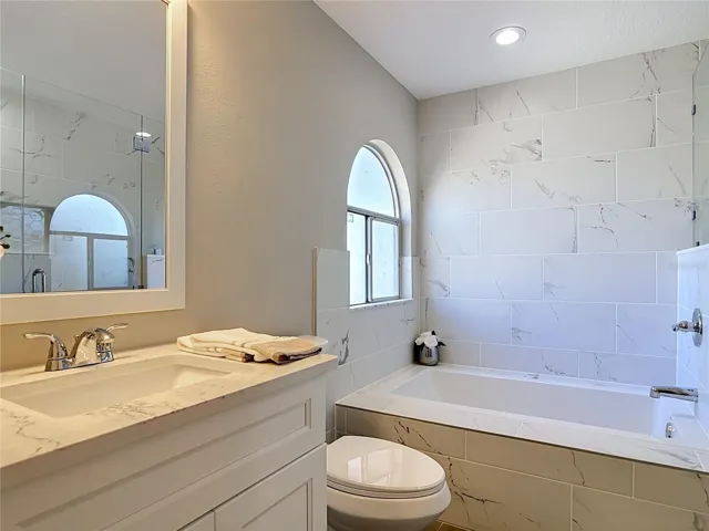 Primary bathroom with soaking tub and separate shower.